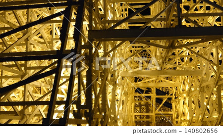 Close-up view of illuminated wooden scaffolding Close-up view of illuminated wooden scaffolding 140802656