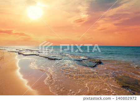 Rocky coast in summer. Beautiful seascape. Sunset beach Rocky coast in summer. Beautiful seascape. Sunset beach 140802972