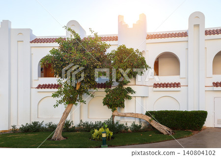 Luxury hotel architecture and elegant courtyard in an Arabian country with traditional design and modern amenities Luxury hotel architecture and elegant courtyard in an Arabian country with traditional design and modern amenities 140804102