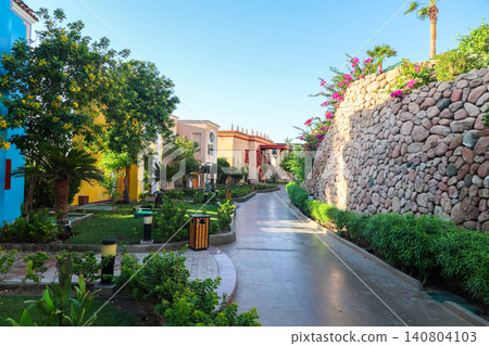 Luxury hotel architecture and elegant courtyard in an Arabian country with traditional design and modern amenities Luxury hotel architecture and elegant courtyard in an Arabian country with traditional design and modern amenities 140804103
