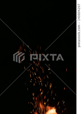 Shallow focus of fire sparks over black background Shallow focus of fire sparks over black background 140804207