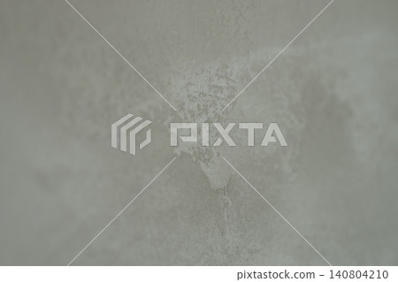 Closeup photo of decorative plaster wall surface Closeup photo of decorative plaster wall surface 140804210
