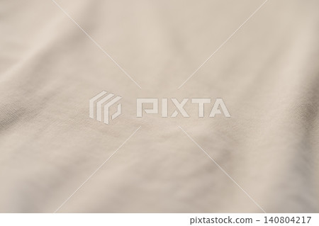 Closeup of beige french terry fabric for hoodies and similar clothes Closeup of beige french terry fabric for hoodies and similar clothes 140804217