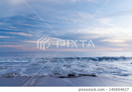 Sunset over the ocean in Malibu with colorful sky and tranquil waves Sunset over the ocean in Malibu with colorful sky and tranquil waves 140804627