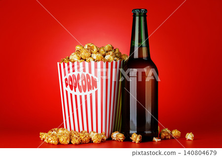 Beer and popcorn in paper bucket Beer and popcorn in paper bucket 140804679