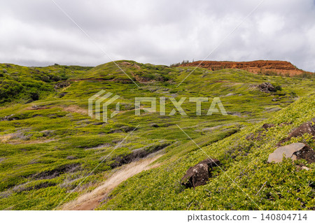 Lush Hawaiian landscape with hills and sky Lush Hawaiian landscape with hills and sky 140804714