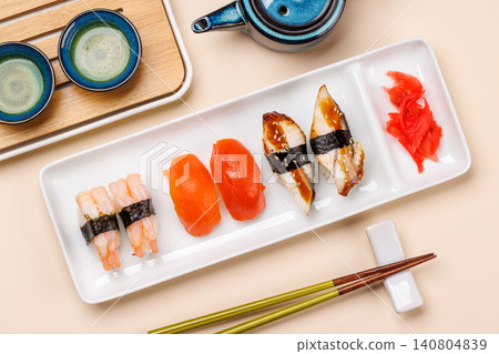 Sushi set with tea and small teapot Sushi set with tea and small teapot 140804839