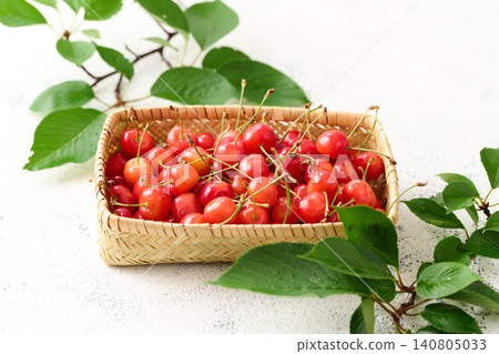 Cherries piled in a basket; Sato Nishiki variety from Yamagata Prefecture. Cherries piled in a basket; Sato Nishiki variety from Yamagata Prefecture. 140805033