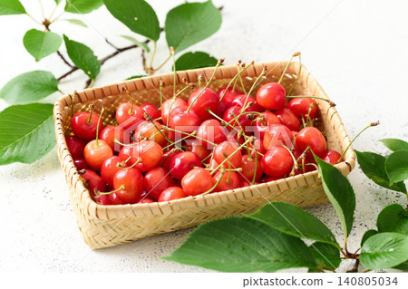 Cherries piled in a basket; Sato Nishiki variety from Yamagata Prefecture. Cherries piled in a basket; Sato Nishiki variety from Yamagata Prefecture. 140805034