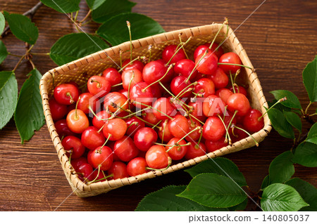 Cherries piled in a basket; Sato Nishiki variety from Yamagata Prefecture. Cherries piled in a basket; Sato Nishiki variety from Yamagata Prefecture. 140805037