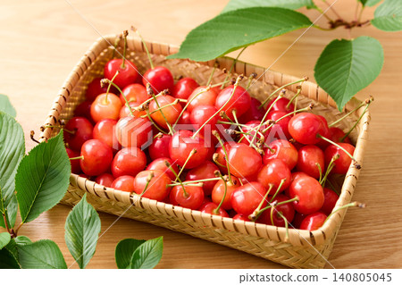 Cherries piled in a basket; Sato Nishiki variety from Yamagata Prefecture. Cherries piled in a basket; Sato Nishiki variety from Yamagata Prefecture. 140805045