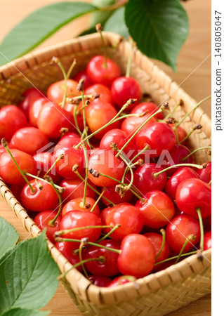 Cherries piled in a basket; Sato Nishiki variety from Yamagata Prefecture. Cherries piled in a basket; Sato Nishiki variety from Yamagata Prefecture. 140805047