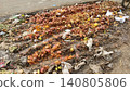 Rotten vegetables and fruits piled beside road in Karachi market 140805806