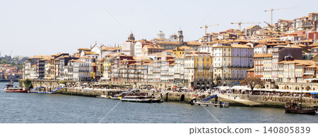 City View of Porto With Colorful Buildings and Riverbank Activity City View of Porto With Colorful Buildings and Riverbank Activity 140805839