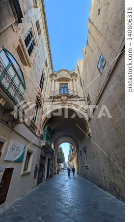Beautiful archway surrounded by historic architecture Beautiful archway surrounded by historic architecture 140806318