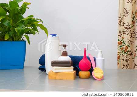 Spa Products. Natural Wellness Set with Peace Lily Plant, Rolled Towels, Organic Soap and Essential bottles with shampoo Copy space Spa Products. Natural Wellness Set with Peace Lily Plant, Rolled Towels, Organic Soap and Essential bottles with shampoo Copy space 140806931