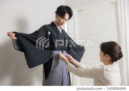 A young man in a hakama with family crest 140806940