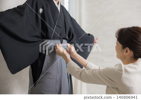 A young man in a hakama with family crest 140806941