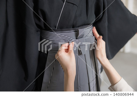 A young man in a hakama with family crest 140806944