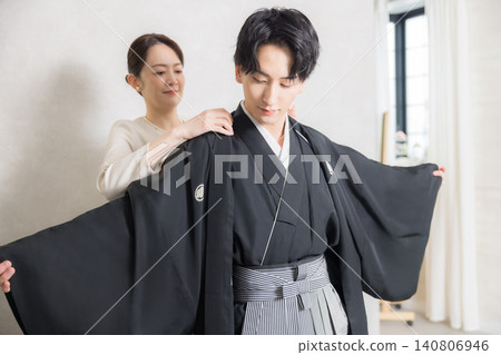 A young man in a hakama with family crest A young man in a hakama with family crest 140806946