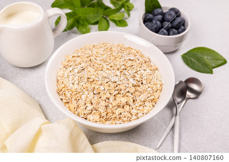 Rolled oats cereal with fresh blueberries and milk 140807160
