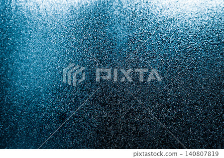 Glass covered with blue condensation creates abstract background 140807819