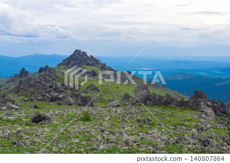 Mountain landscape with green grass and rocks Mountain landscape with green grass and rocks 140807864