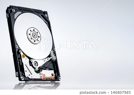 a computer's hard disk hdd data storage drive without shield isolated in white background show magnetic disc and electronic part inside a computer's hard disk hdd data storage drive without shield isolated in white background show magnetic disc and electronic part inside 140807985