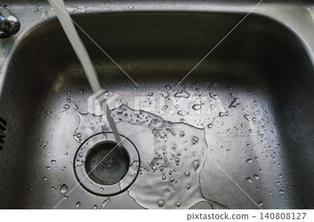 a wet dirty sink after washing many dishes photo may had noise and gain a wet dirty sink after washing many dishes photo may had noise and gain 140808127