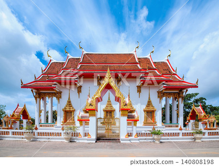 Thai style buddhis temple in cloudy bright blue sky Thai style buddhis temple in cloudy bright blue sky 140808198