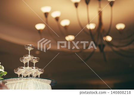 small tower of champagne's glass in wedding reception party small tower of champagne's glass in wedding reception party 140808218