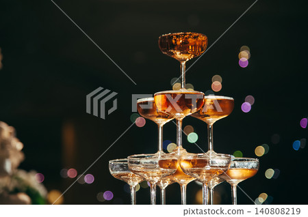 small tower of champagne's glass in wedding reception party small tower of champagne's glass in wedding reception party 140808219