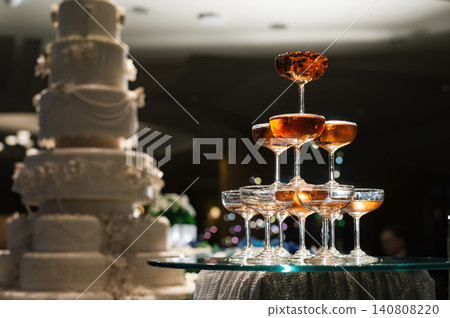 small tower of champagne's glass in wedding reception party small tower of champagne's glass in wedding reception party 140808220