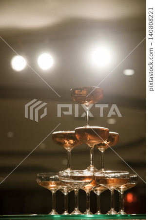 small tower of champagne's glass in wedding reception party 140808221