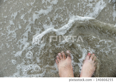 two feets of man and woman stand together on sand, abstract photograph, background, couple two feets of man and woman stand together on sand, abstract photograph, background, couple 140808255