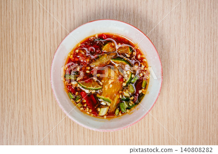 thai style spicy chili sauce mixed from fish sauce, red chili, lime, sliced scallion etc thai style spicy chili sauce mixed from fish sauce, red chili, lime, sliced scallion etc 140808282