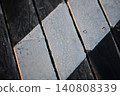 The deck is dripping with morning dew. 140808339