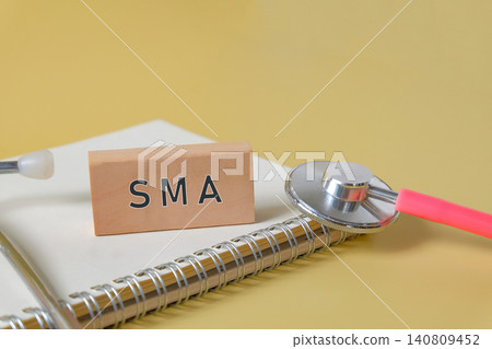 A wood cube with the text SMA and Stethoscope. A wood cube with the text SMA and Stethoscope. 140809452