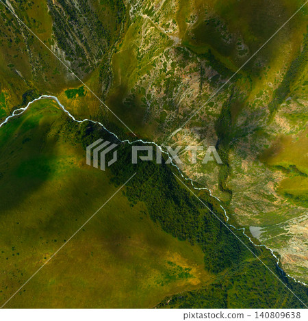 Aerial View of Winding River Through Mountain Landscape Aerial View of Winding River Through Mountain Landscape 140809638