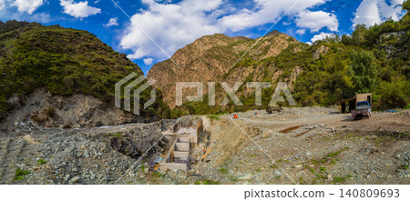 Small hydroelectric power plant construction in mountain valley Small hydroelectric power plant construction in mountain valley 140809693