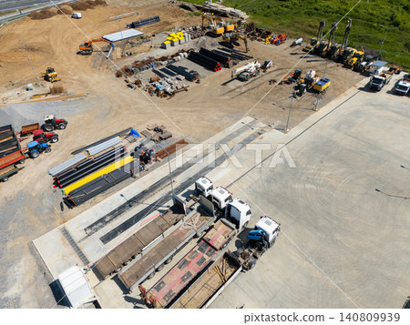 Top view of heavy construction trucks parked in a rows Top view of heavy construction trucks parked in a rows 140809939