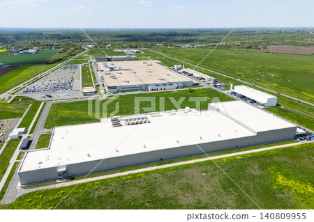 Aerial view of a massive industrial zone with manufacturing plants and warehouses Aerial view of a massive industrial zone with manufacturing plants and warehouses 140809955