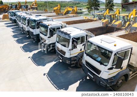 Constructions trucks and machines are parked in a rows Constructions trucks and machines are parked in a rows 140810043