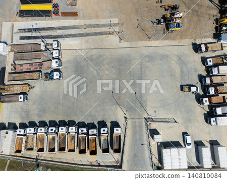 Top view of heavy construction trucks parked in a rows. 140810084