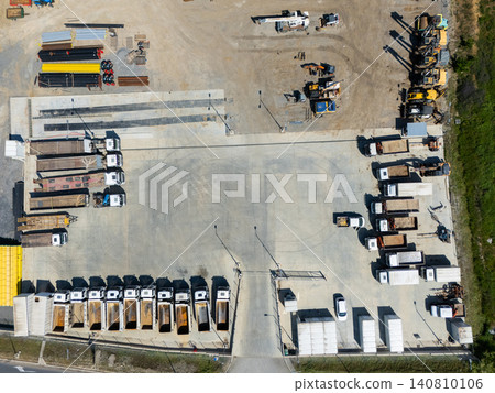 Top view of heavy construction trucks parked in a rows Top view of heavy construction trucks parked in a rows 140810106