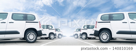White delivery vans are parked in rows. Commercial fleet of vehicles. White delivery vans are parked in rows. Commercial fleet of vehicles. 140810169