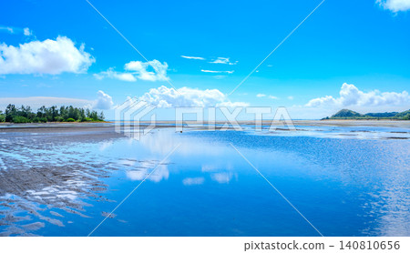A reflection of the blue sky in the shallow waters between Iriomote Island and Yubu Island in Okinawa Prefecture. A reflection of the blue sky in the shallow waters between Iriomote Island and Yubu Island in Okinawa Prefecture. 140810656