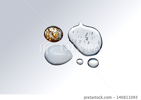 Skincare ingredients forming drops and swirls on surface Skincare ingredients forming drops and swirls on surface 140811093