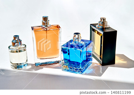 Assortment of luxury fragrance bottles on white surface 140811199
