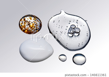Skincare product drops with serum texture and gold flakes Skincare product drops with serum texture and gold flakes 140811361